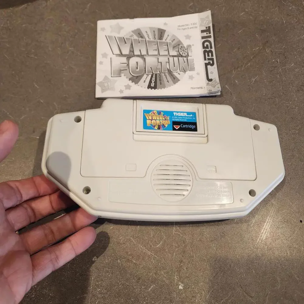 Wheel of Fortune Handheld Electronic Game works perfect EUC condition booklet